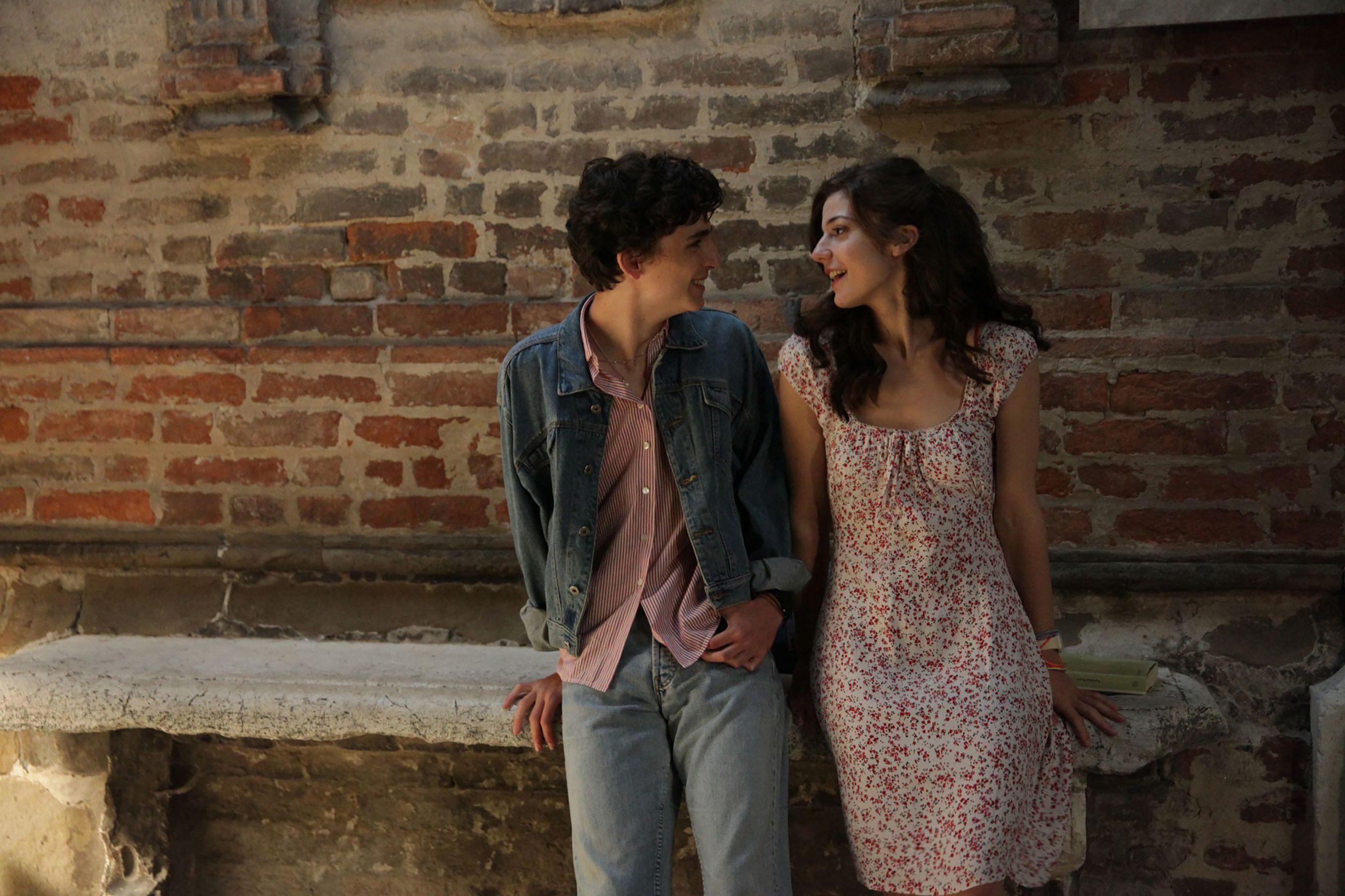 Elio and Marzia smiling at one another