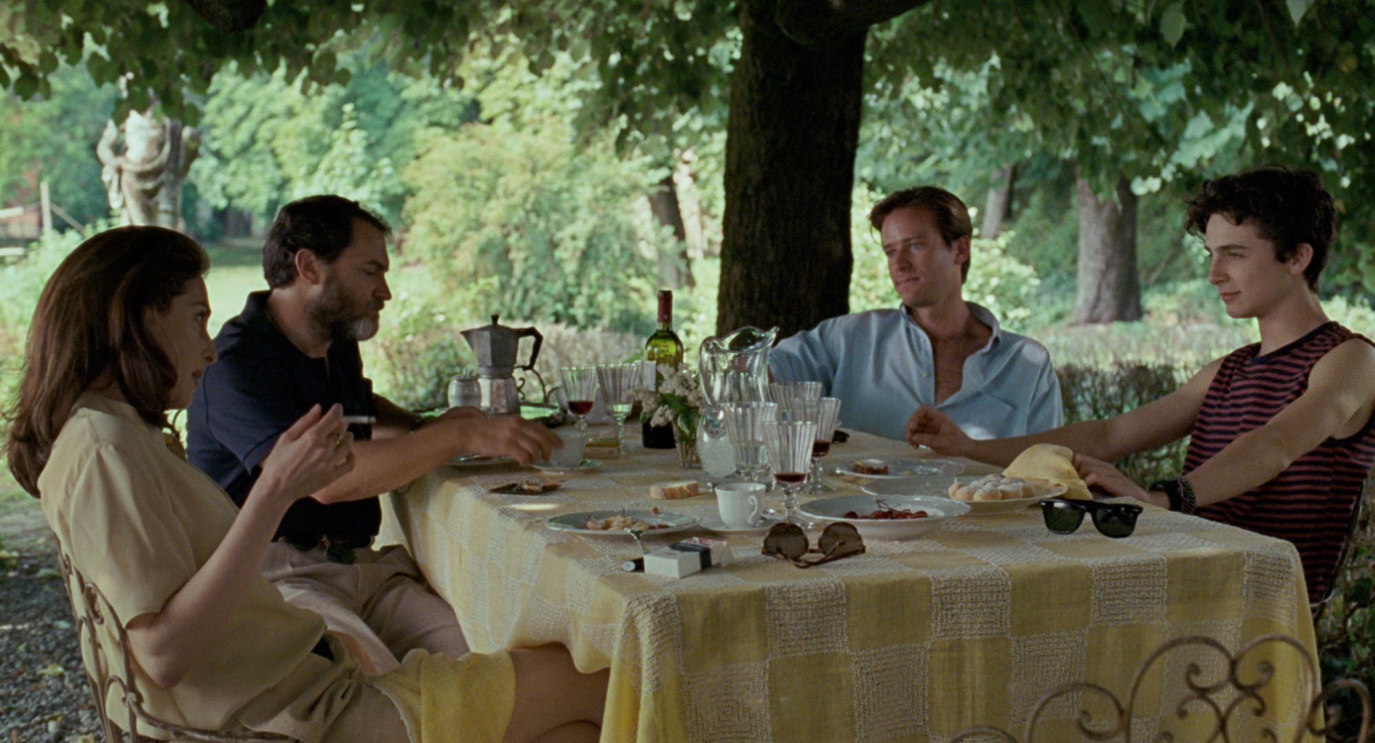 Characters eating in a garden